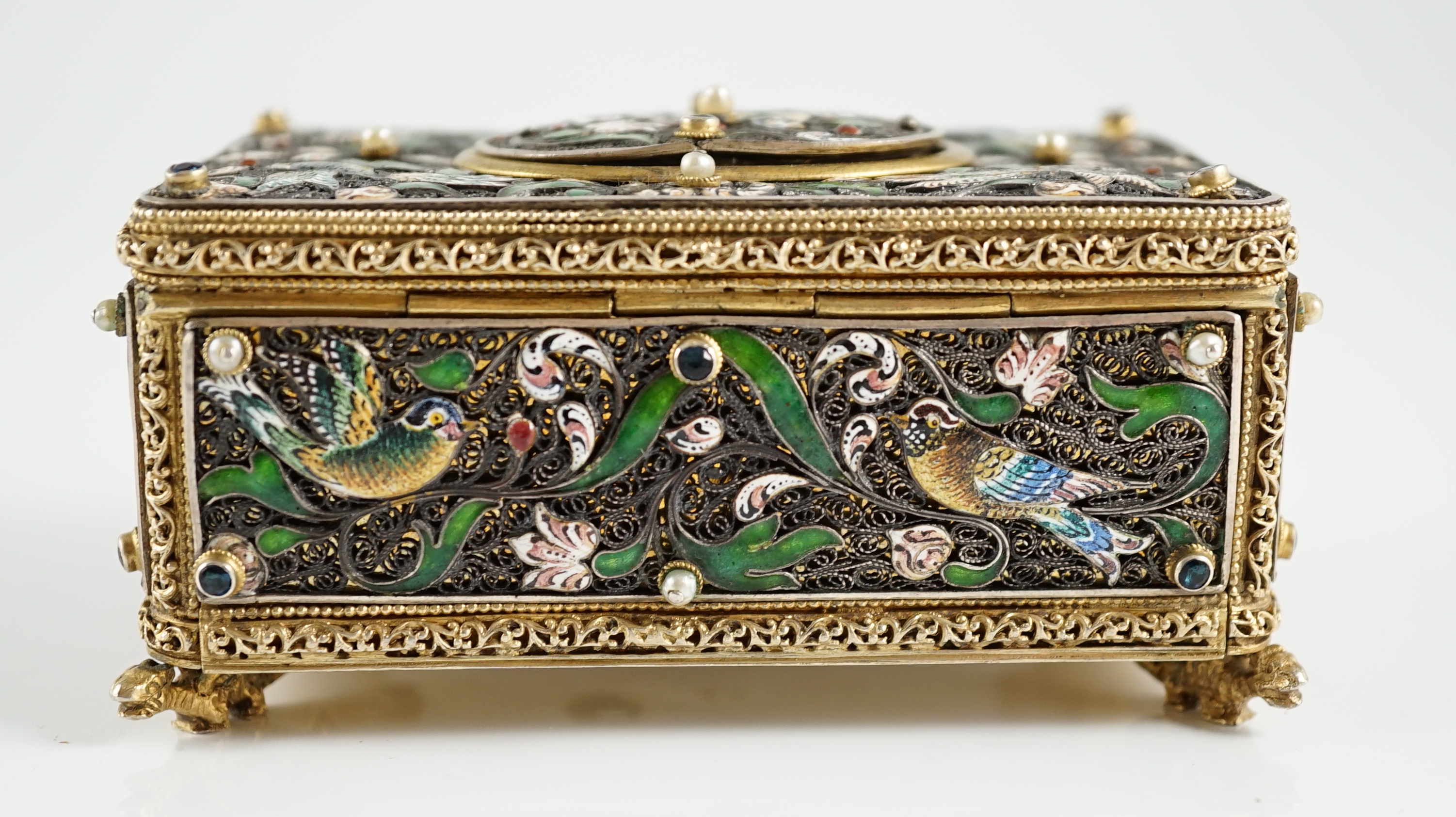 A 19th century Austro-Hungarian 800 standard silver gilt, jewelled and enamelled rectangular singing bird box automaton